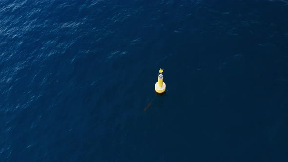 Yellow Marine Buoy in the Ocean