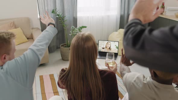 Young People Celebrating with Friend Over Video Call