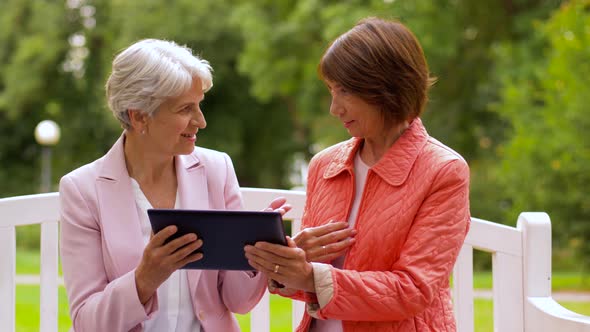 Senior Women with Tablet Pc at Summer Park