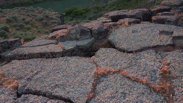 Tilt up from canyon rim to the Snake River during sunrise