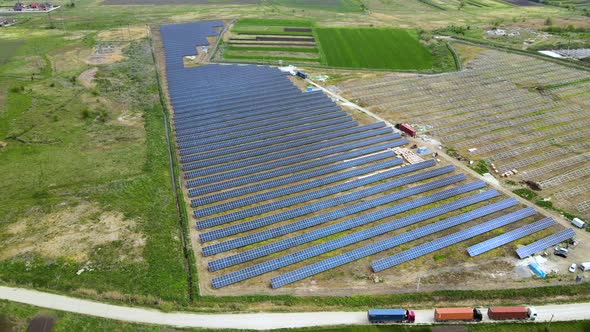 Aerial View of Electrical Power Plant Under Construction with Truck Delivering Assembly Parts for