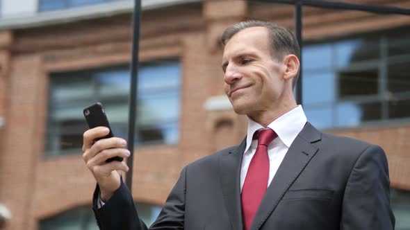 Businessman Using Smartphone