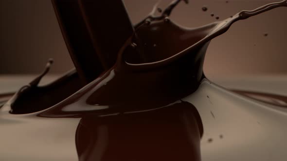 Super Slow Motion Shot of Pouring Melted Chocolate on Brown Gradient Background at 1000 Fps