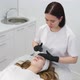 Cosmetologist Applies a Woman a Therapeutic Mask on Her Face - VideoHive Item for Sale