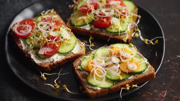 Healthy Toasts with Cucomber, Tomatoes and Crumbled Feta and Radish Sprouts