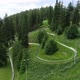 Aerial view of bobsleigh track on green mountain hill. Downhill with summer bobsleigh. - VideoHive Item for Sale