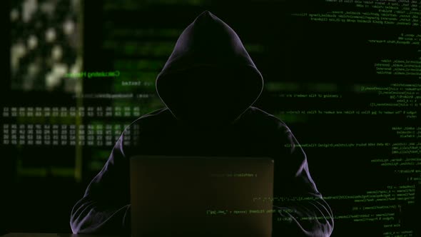 Hacker Opening Laptop to Check Virus Breaking System Codes, Stealing Data