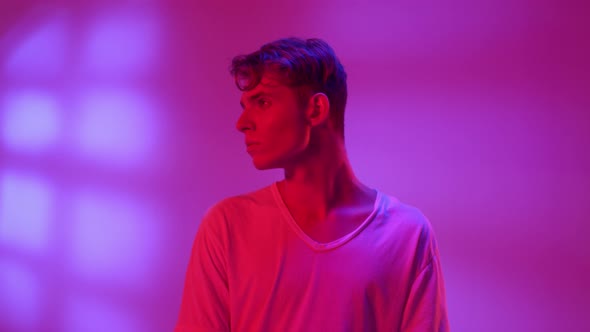 Young Beautiful Man in Neon Lights