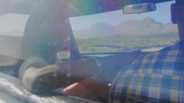 Young couple on a road trip in their pick-up truck