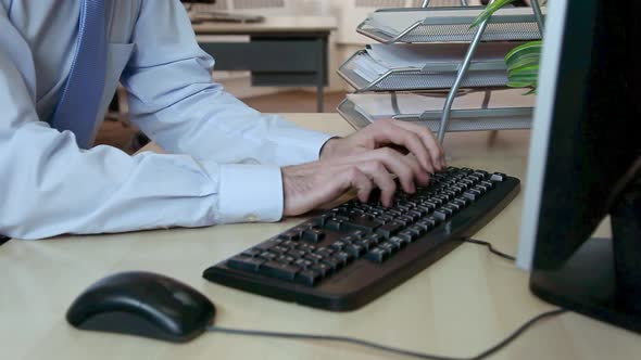 Office worker using computer keyboard