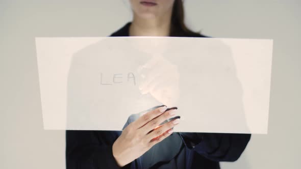 Corporate Woman Writing Leadership On A Board