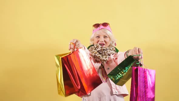 Old Woman Expresses Positive Emotion, Does the Shopping at Weekend