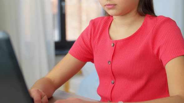 Student Girl with Laptop Computer Learning at Home