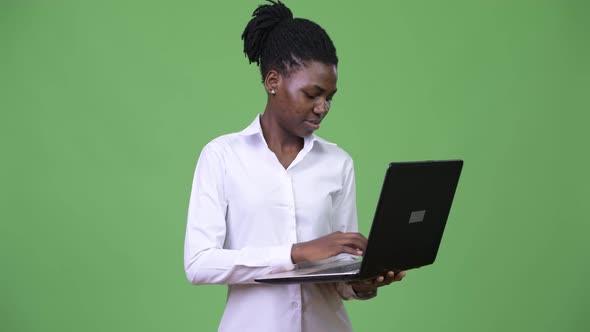 Young Beautiful African Businesswoman Using Laptop