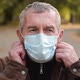 Close Up Portrait of Senior Man Wearing Protective Medical Face Mask - VideoHive Item for Sale
