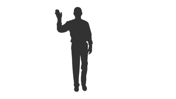 Silhouette of Young Man Waving Greetings While Walking