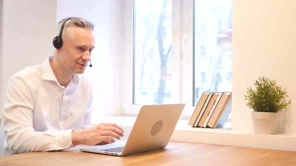 Customer Service, Middle Age Man Talking in Call Center