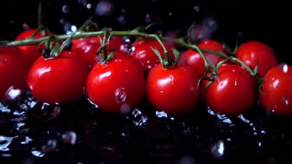 The Falling Cherry Tomatoes in Water