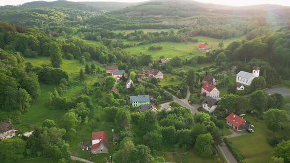 Aerial View of Countryside Area with Village and Mountains