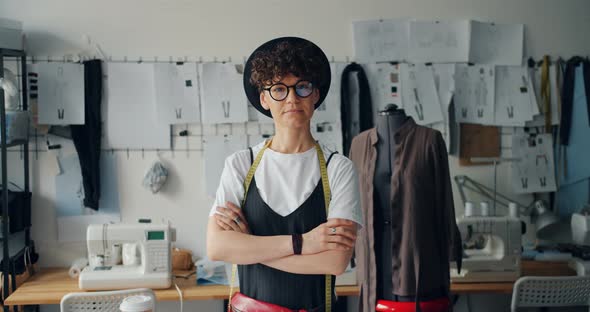 Portrait of Independent Woman Designer Standing in Studio with Arms Crossed