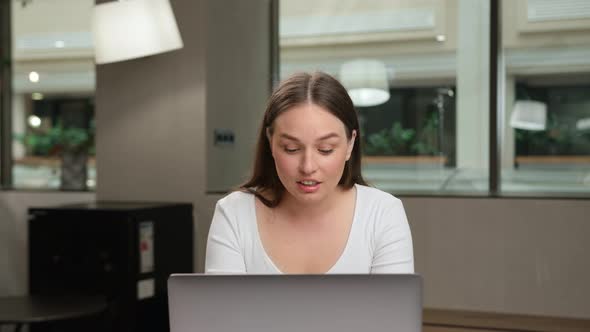 Female office worker chatting on zoom with work colleagues or clients