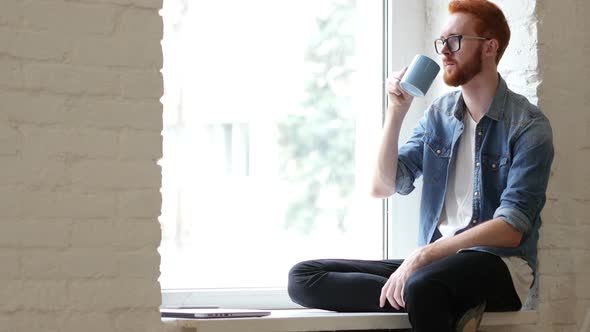 Pensive Man Drinking Coffee, Tea, Sitting Relax in Window