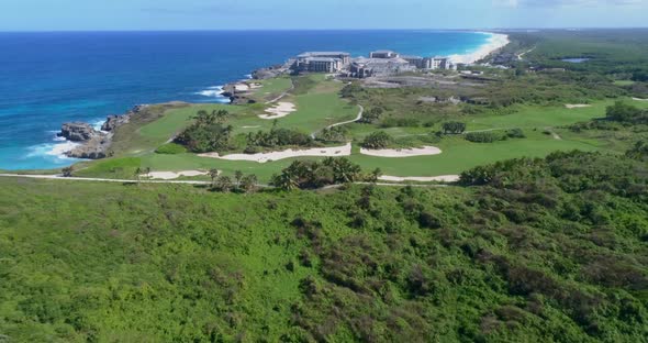 Take back with drone, overlooking the construction of a large Roco Ki ​​Hotel, overlooking the golf