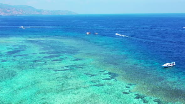 Aerial above landscape of paradise shore beach journey by clear ocean with white sandy background of