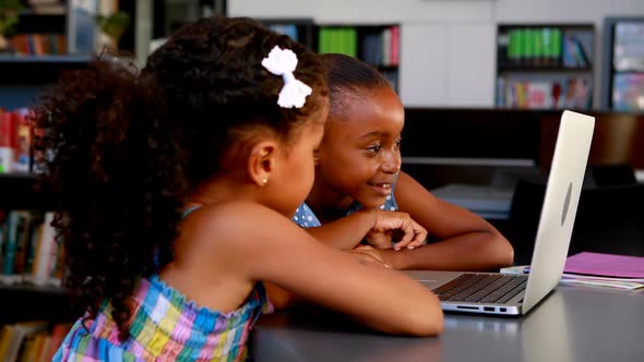 Schoolgirls using laptop 4k