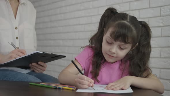 A child with a psychologist.