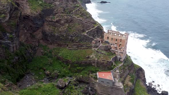 Drone aerial view of an abandoned house ruins next to the ocean. The Gordejuela ruins (Las Ruinas de