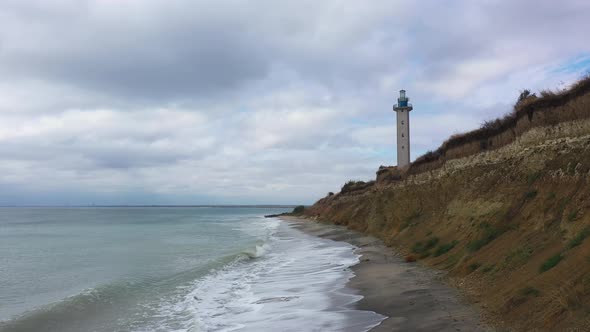 Aerial view to a lighthouse over a beach