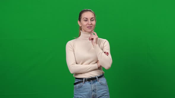 Portrait of Flirty Young Caucasian Woman Looking at Camera with Seductive Facial Expression