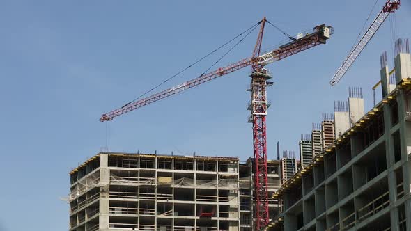 Working Construction Crane on a Background of Clear Blue Sky