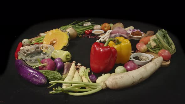 A Selection Of Various Colorful Vegetable, Spices And Fresh Fish Fillets On Black Table.