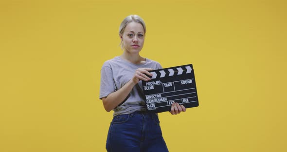 Bored Woman Clapping Clapperboard