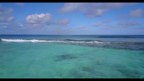 Aerial drone shot texture of exotic seashore beach trip by blue ocean with white sand background of 