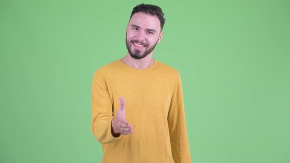 Happy Young Handsome Bearded Man Giving Handshake