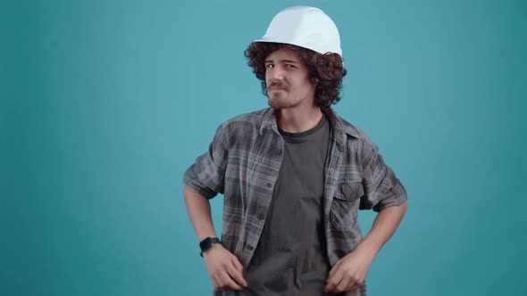 The Charismatic Young Man Proudly Puts His Engineer's Helmet on His Head Ensures Her Safety By