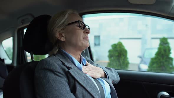 Woman in Business Suit Touching Chest Feeling Acute Pain, Risk of Heart Attack