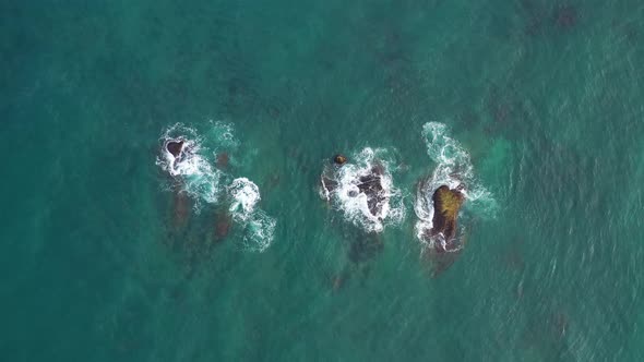 Aerial view of rocks in the ocean near Bentota Beach, Sri Lanka.