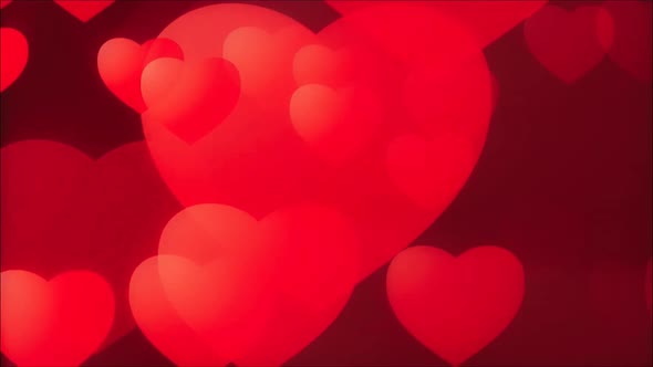 Abstract red hearts on dark background.
