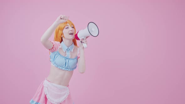 Youthful European Cheerleader Cosplayer With Megaphone Chanting Medium Long Studio Shot Pink