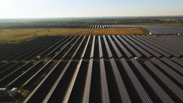 Drone Flight Over Rows of Solar Panels