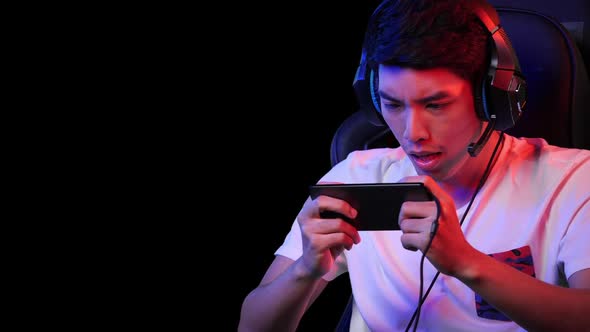 man playing game on smartphone