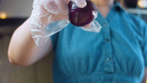 The Cook Throws a Red Onion in the Air and It Splits Into Two Pieces