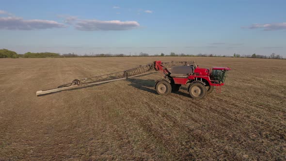 Agricultural Machinery at Work in the Field Folding the Extensions Irrigation