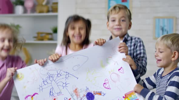 Little Children Showing Their Artwork alt