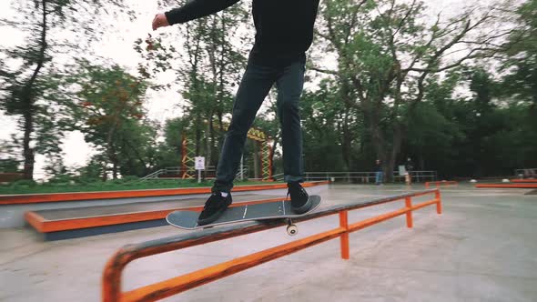 Skateboarder in Skate Park Doing Tricks Slow Motion