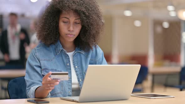 Online Payment Vai Laptop By African Woman at Work 